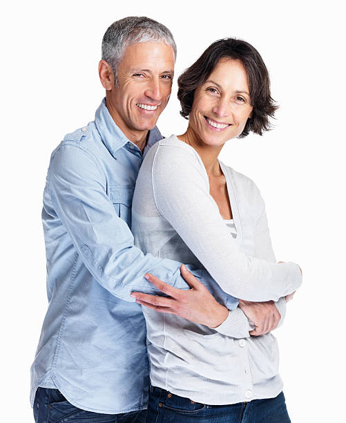 istock Happy couple posing together on white background 121198176