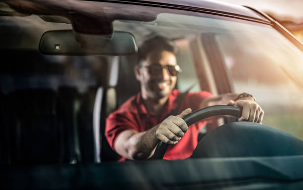 istock Middle Eastern Man Driving a Car. 1211981779