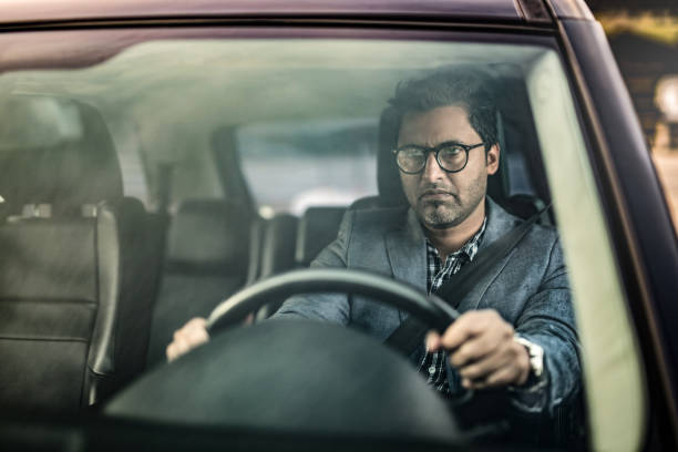istock Angry Middle Eastern Businessman Driving A Car. 1211981924