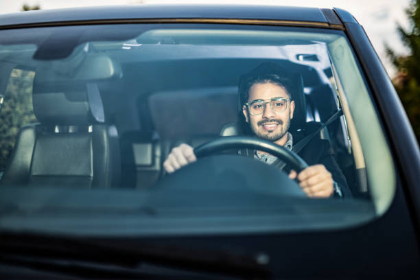 istock Middle Eastern Businessman Driving A Car. 1211981955