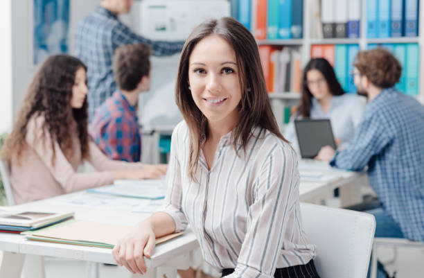 istock Young business team and girl smiling 1211982011