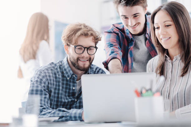 istock Young business team discussing a project 1211982644
