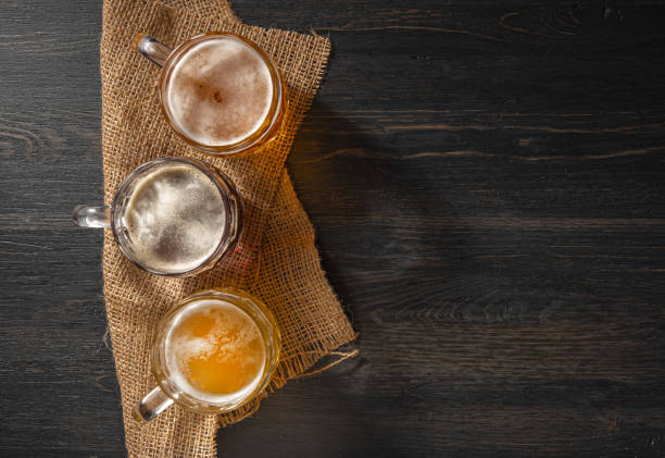 three glasses of different craft beer - beer nuts imagens e fotografias de stock