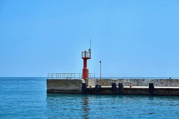 istock concrete berth for boats with signal beacon 1211982766