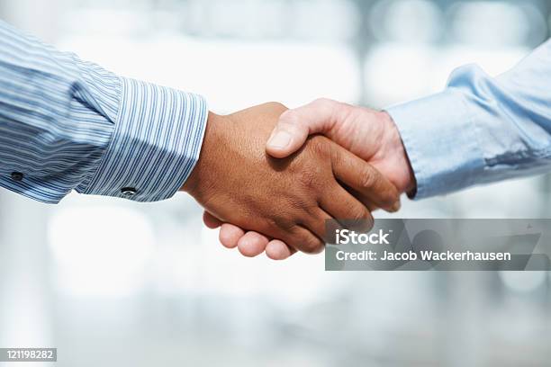 Handshake Between Two Business Executives Stock Photo - Download Image Now - Handshake, Business, Partnership - Teamwork