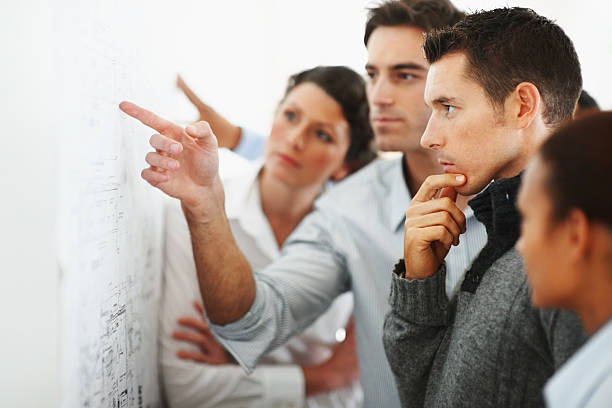 Group of business people looking at a chart