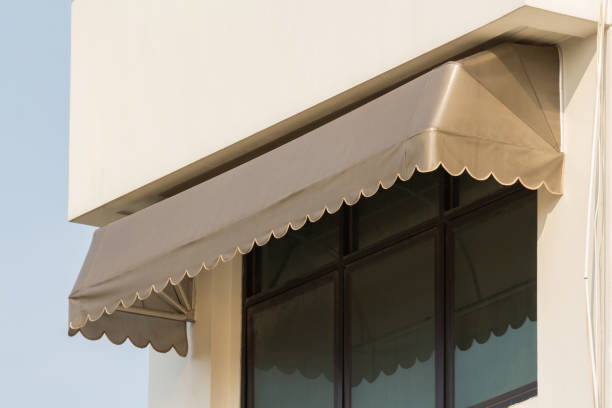 istock brown canvas awning over house window. 1211984555