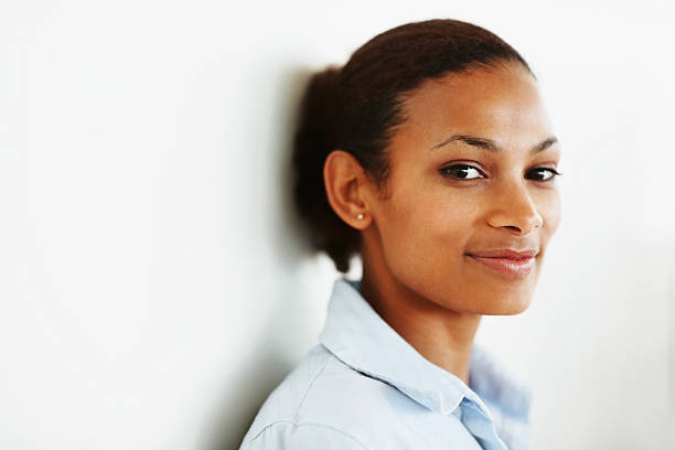 Cute young woman smiling against a white wall  stars in your eyes stock pictures, royalty-free photos & images