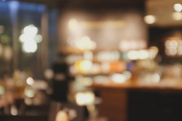 istock Blurred background of Cafe with abstract bokeh light. 1211987444