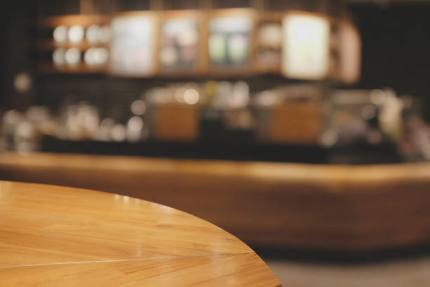 istock Top wood table with Blurred background of Cafe with abstract bokeh light. 1211988001