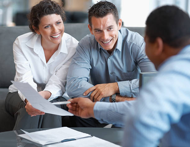 istock Financial Planning - Couple getting consulted 121198810