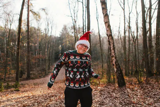 December 1, 2018 - Kampinos, Poland: fake Santa Claus - teenager boy having fun in a autumn forest
