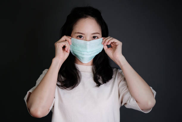 istock Girl with mask to protect her from virus or pollution 1211989229