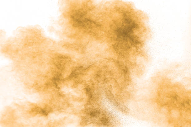 istock Brown powder dust cloud.Brown particles splattered on white background. 1211989327