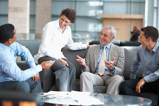 istock Business executives having a casual talk at office lounge 121198972