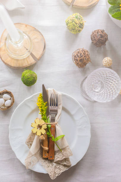 istock Easter festive spring table setting decoration, eggs in nest, selective focus, toned, top view 1211990093