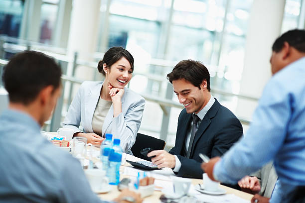 istock Smiling business executive sitting for a boardroom meeting 121199299