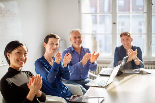 istock Business team applauding after a presentation 1211994275