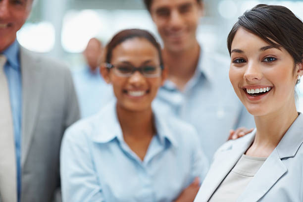 istock Successful business leader with her colleagues smiling 121199436