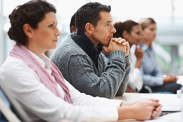 istock Business executives attending a seminar - paying attention 121199522