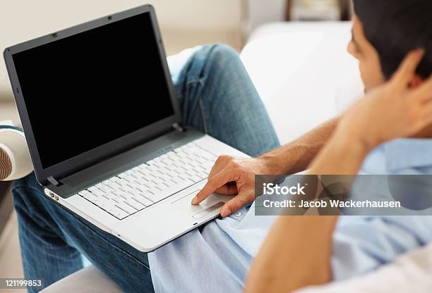Closeup Of Guy Working On A Laptop Indoor Stock Photo - Download Image Now - Laptop, Computer Monitor, Men