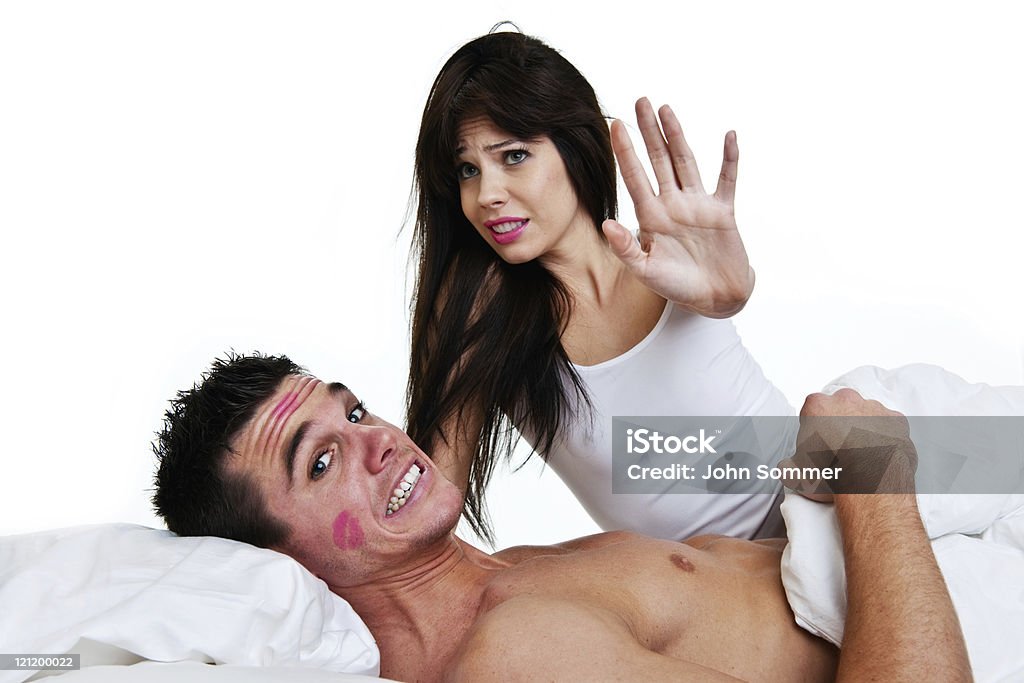 Mann und Frau Gefangenen im Bett - Lizenzfrei Humor Stock-Foto