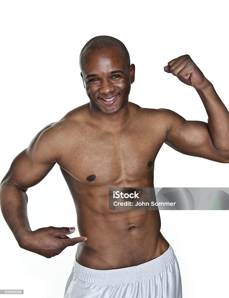 Man flexing and pointing to his waist Man shot on white background flexing and pointing to his waist 20-24 Years Stock Photo