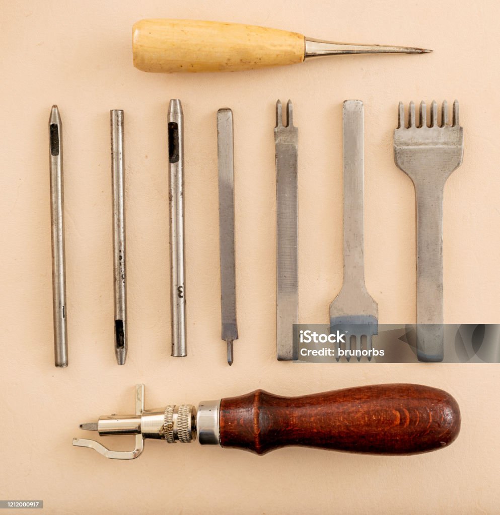 Leather Working Tools And Rolled Up Hide Organized Stock Photo - Download  Image Now - Awl, Backgrounds, Bevel - iStock
