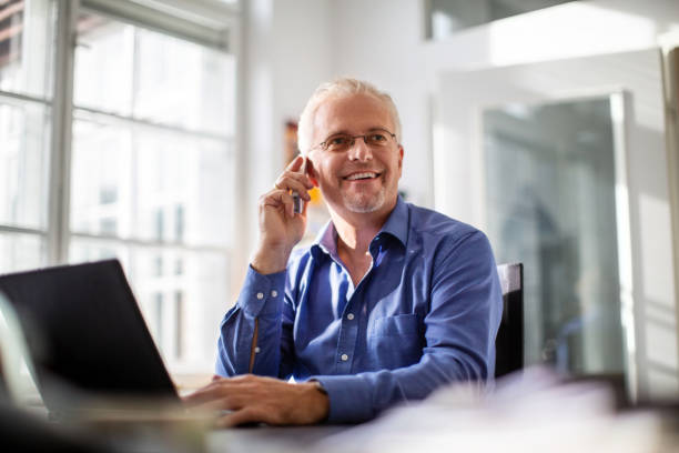 istock Businessman working at his office desk 1212000958