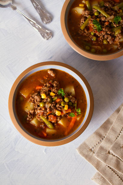 istock Bowl of ground beef soup with vegetables 1212003355