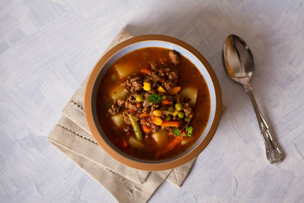 istock Bowl of ground beef soup with vegetables 1212003383