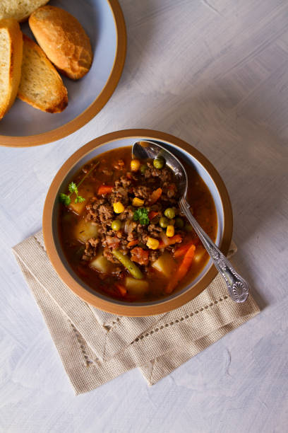 istock Bowl of ground beef soup with vegetables 1212003428