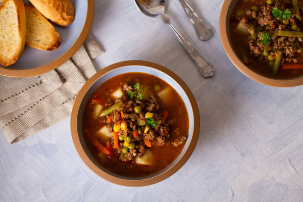 istock Bowl of ground beef soup with vegetables 1212003471