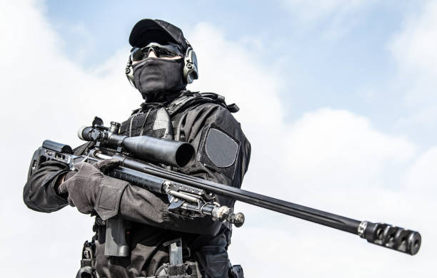 istock Police tactical group sniper with rifle in hands 1212003717