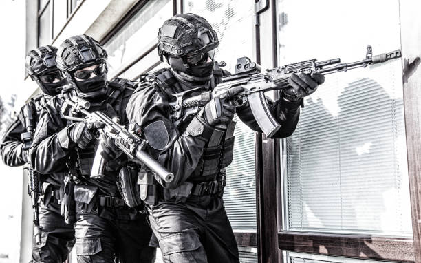istock Police counter terrorist team squad storming building 1212003729