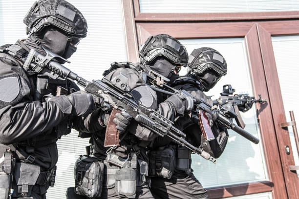 istock Police counter terrorist team squad storming building 1212003730