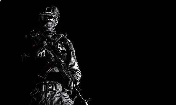 istock Elite police squad member in tactical ammunition 1212004404