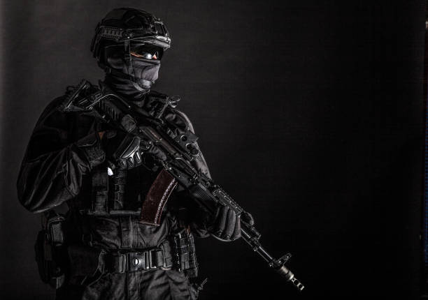 istock Elite police squad member in tactical ammunition 1212004540