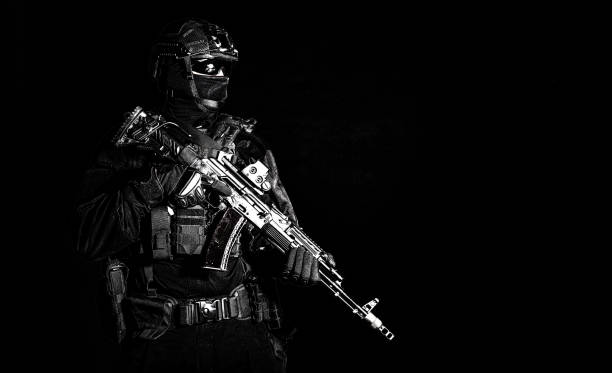 istock Equipped elite forces soldier low key portrait 1212004552