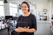 Businesswoman holding a digital tablet in office