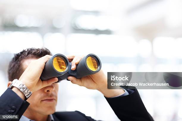Business Man With Binoculars Looking To The Future Stock Photo - Download Image Now - Adult, Adults Only, Aspirations