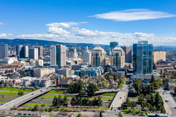 Downtown Oakland Skyline An aerial view of the downtown Oakland skyline on a clear sunny day.
The federal building and other iconic buildings fill the skyline. oakland california stock pictures, royalty-free photos & images