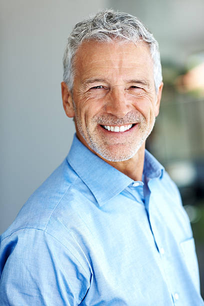 istock Handsome senior male entrepreneur smiling 121200935