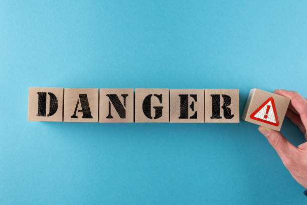 istock word DANGER and warning sign on wood cubes 1212009999