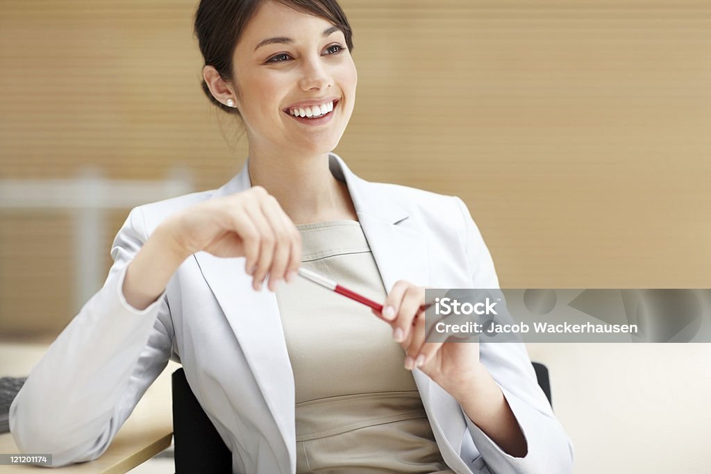 Smiling young business woman thinking about something  Adult Stock Photo