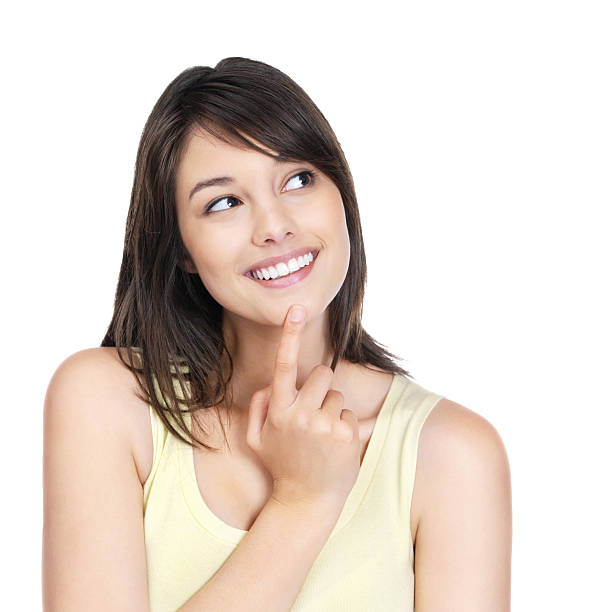 istock Female with finger on chin looking thoughtfully at copyspace 121201290