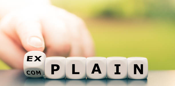 istock Explaining instead of complaining. Hand turns dice and changes the word 