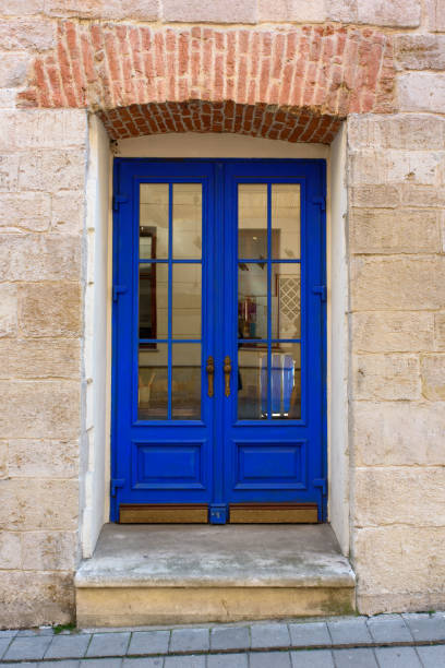 istock Blue door with brick wall at Lviv, Ukraine. 1212014989