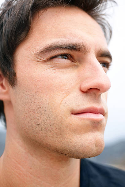 istock Close-up of a young guy looking away in thought 121201681