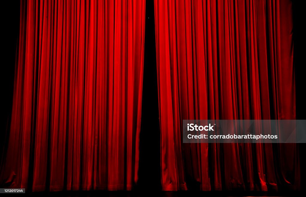 the curtain is opening, the show begins the show begins in the hall Curtain Stock Photo
